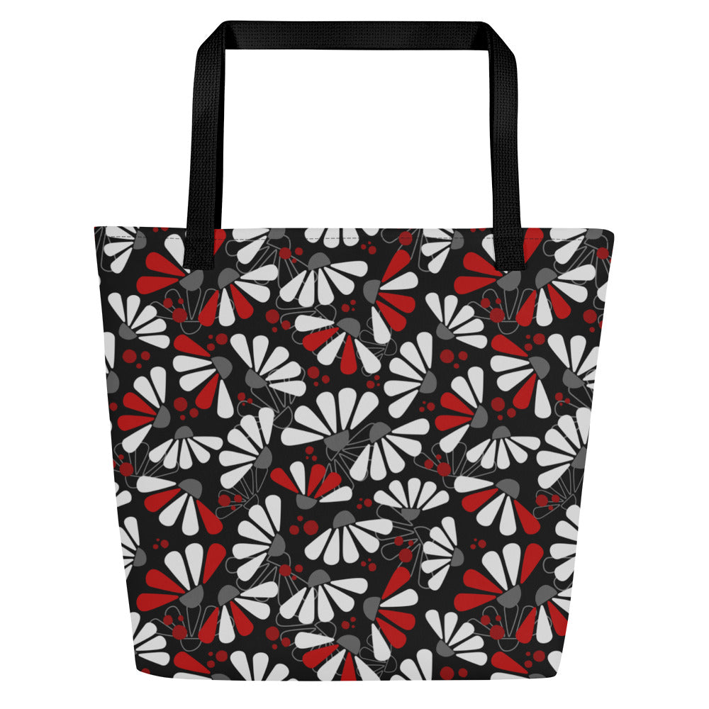 Stylish tote bag with black handles, featuring a white, red, and gray abstract coneflowers floral pattern against a black background, conveying a modern and chic vibe.