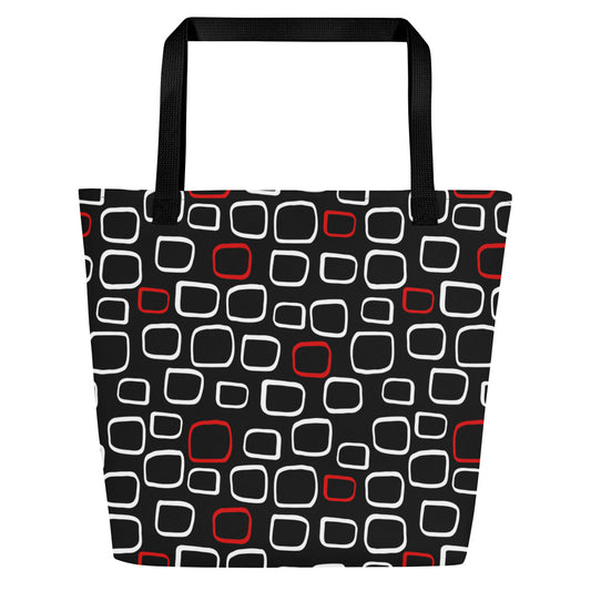 Tote bag with black handles, featuring a black background with red and white outlined geometric squares, creating a modern, playful pattern.