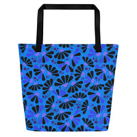Blue tote bag with black handles, featuring a bold coneflowers pattern of black and purple abstract shapes resembling flowers; a vibrant and modern design.
