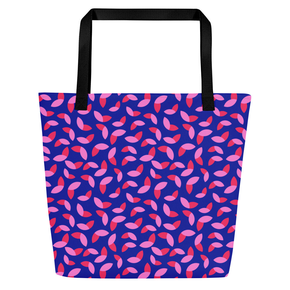 Tote bag with black handles features a vibrant abstract pattern of hot and flamingo pink petals on a dark blue background, conveying a bold and lively tone.