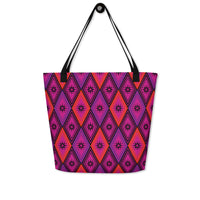 Tote bag with black handles, featuring a vibrant diamond pattern. The design alternates between pink and fuchsia, decorated with black starburst floral motifs.