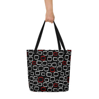 Tote bag with black handles, featuring a black background with red and white outlined geometric squares, creating a modern, playful pattern.