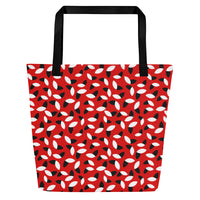 Red tote bag with a bold pattern of alternating black and white petal shapes. Features sturdy black handles, creating a modern and vibrant look.