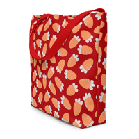 Red tote bag with a playful pattern of orange and white carrots. The bag has red handles, conveying a cheerful and vibrant tone.